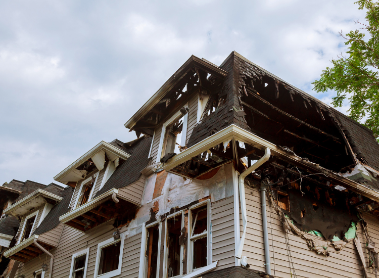 Burnt and charred roof structure of a home.