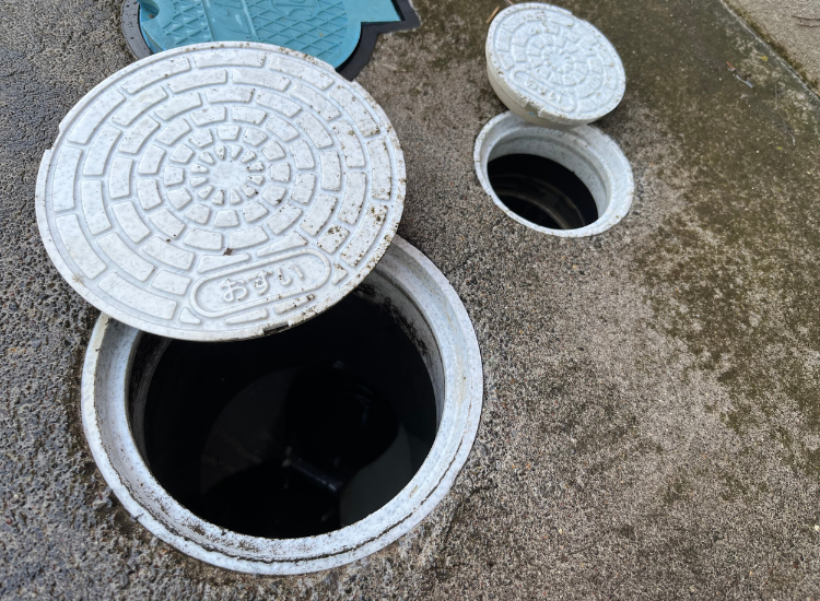 Close-up of shifted plastic drainage lids.